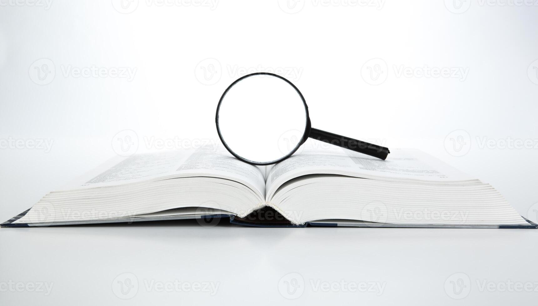 open book with loupe photo
