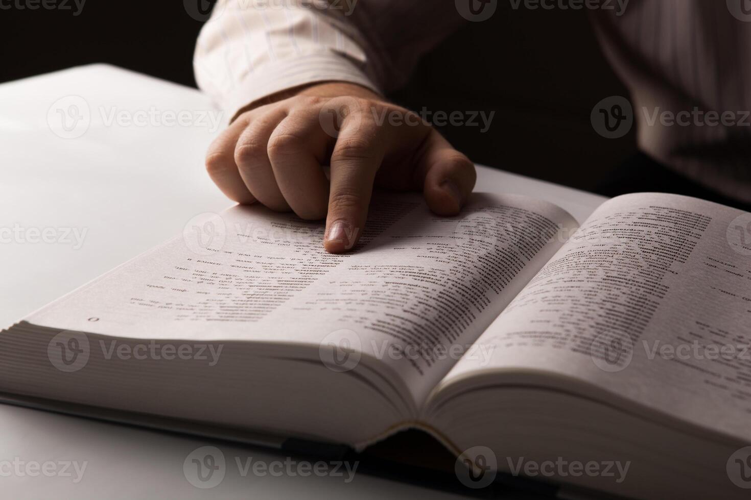 man is looking for information in the directory photo