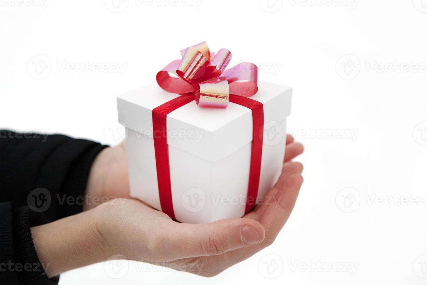 Female hands give you a gift box photo