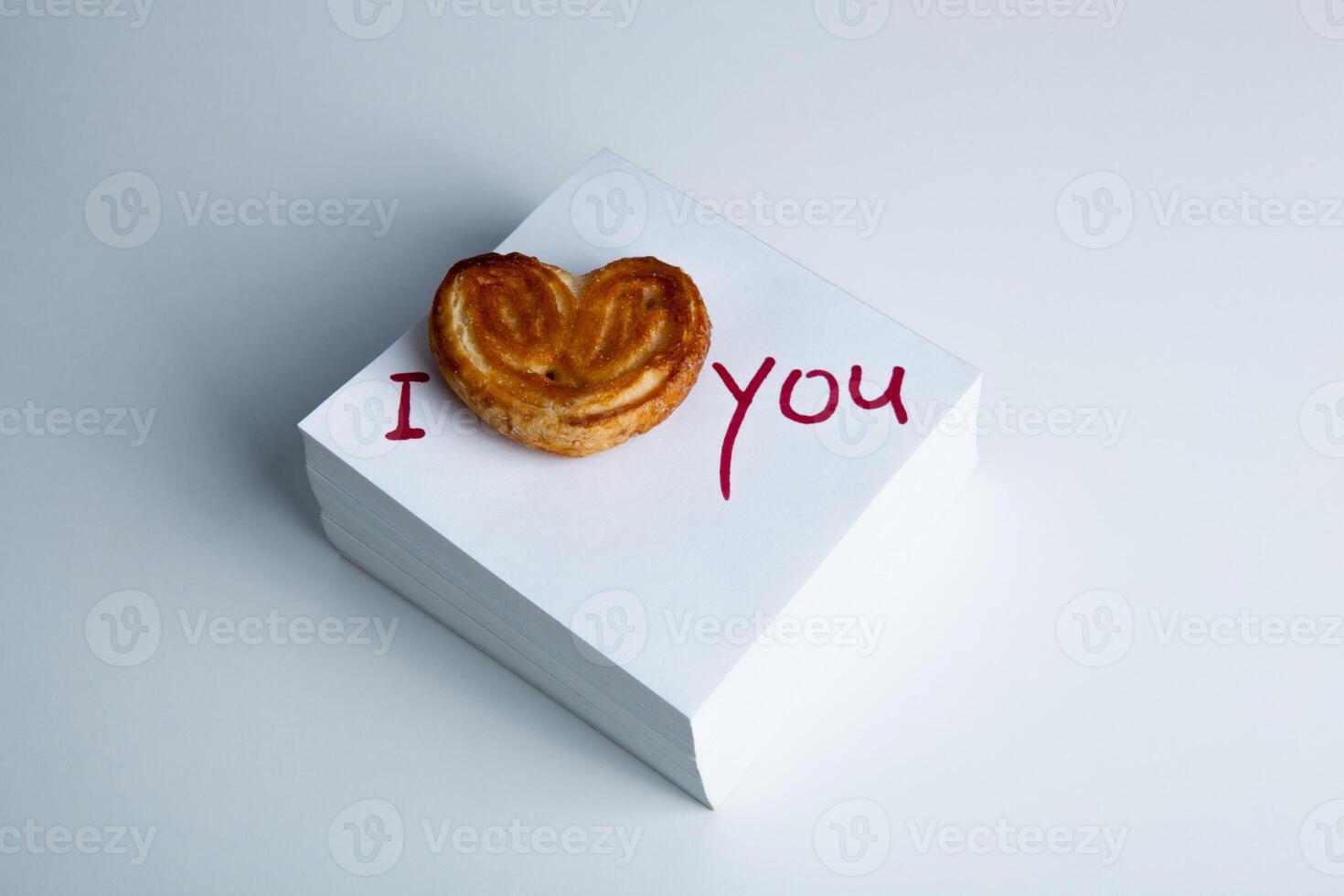 notebook with marker inscription I love you and biscuit photo