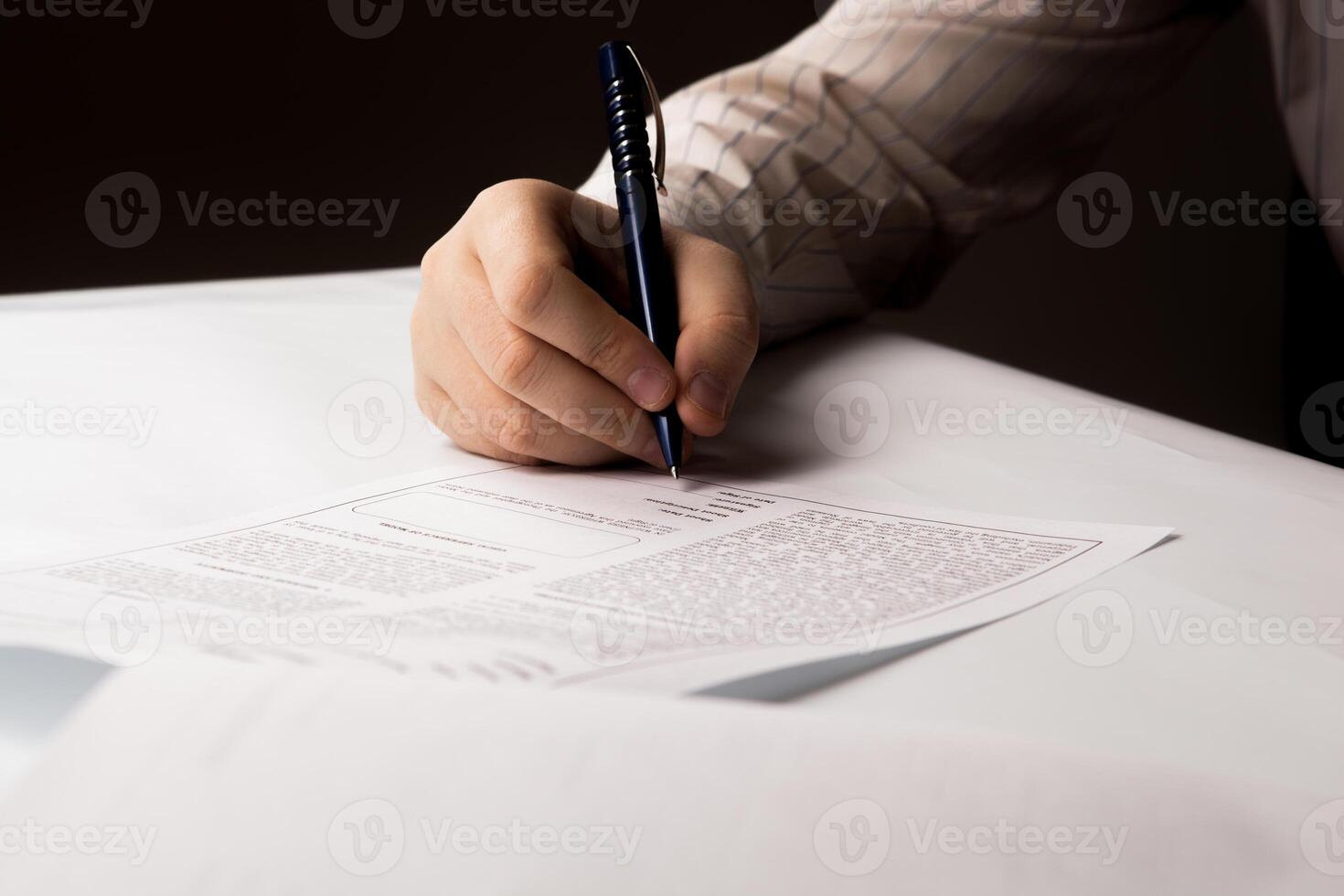 man signing a contract photo