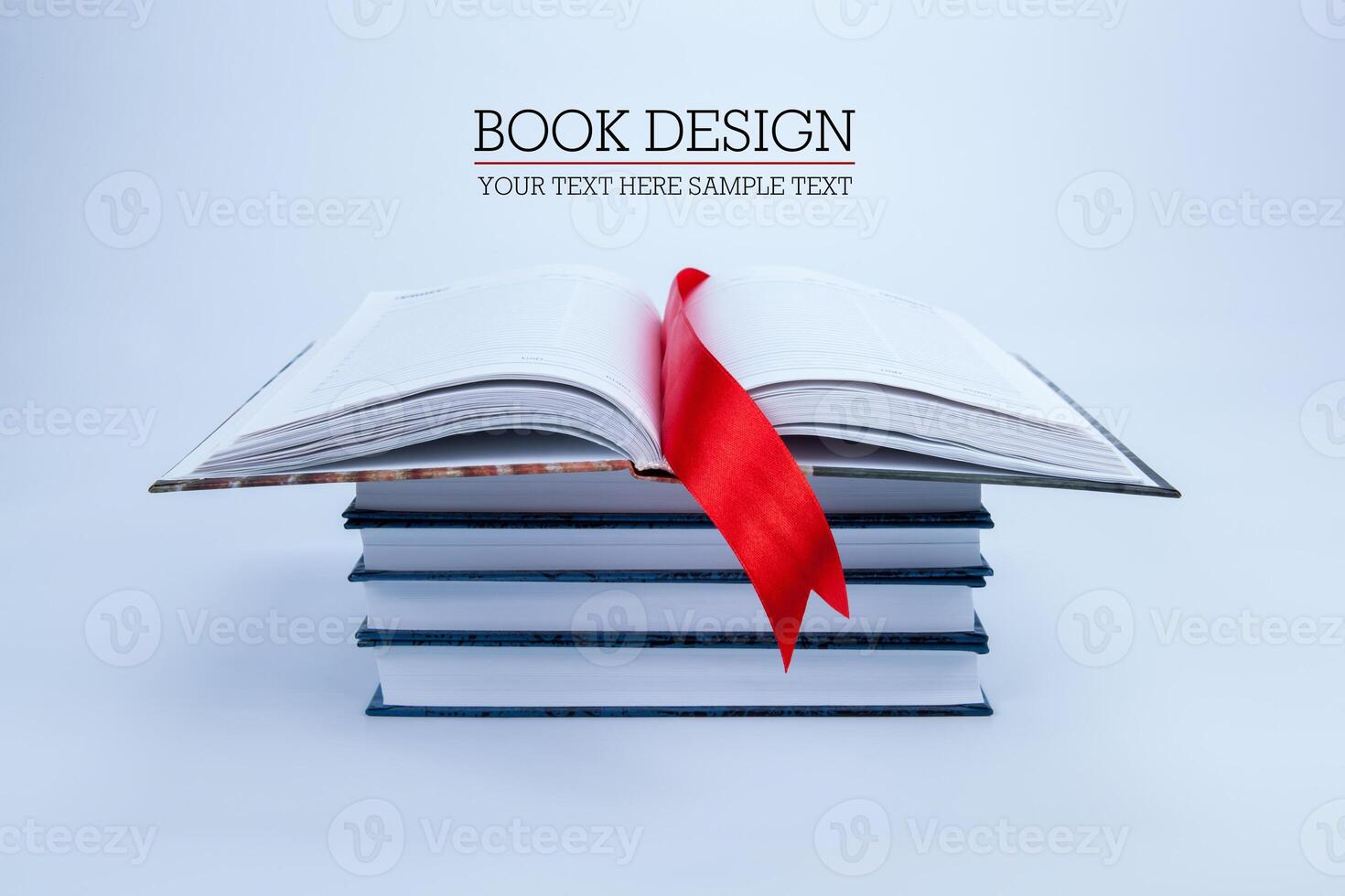 open book on a pile of books photo