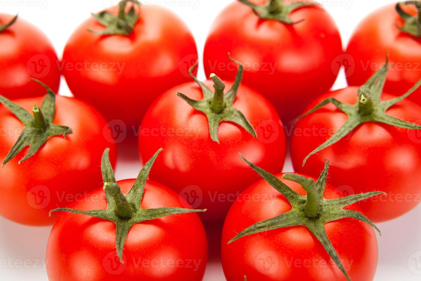 some red tomatoes close-up on a white background photo