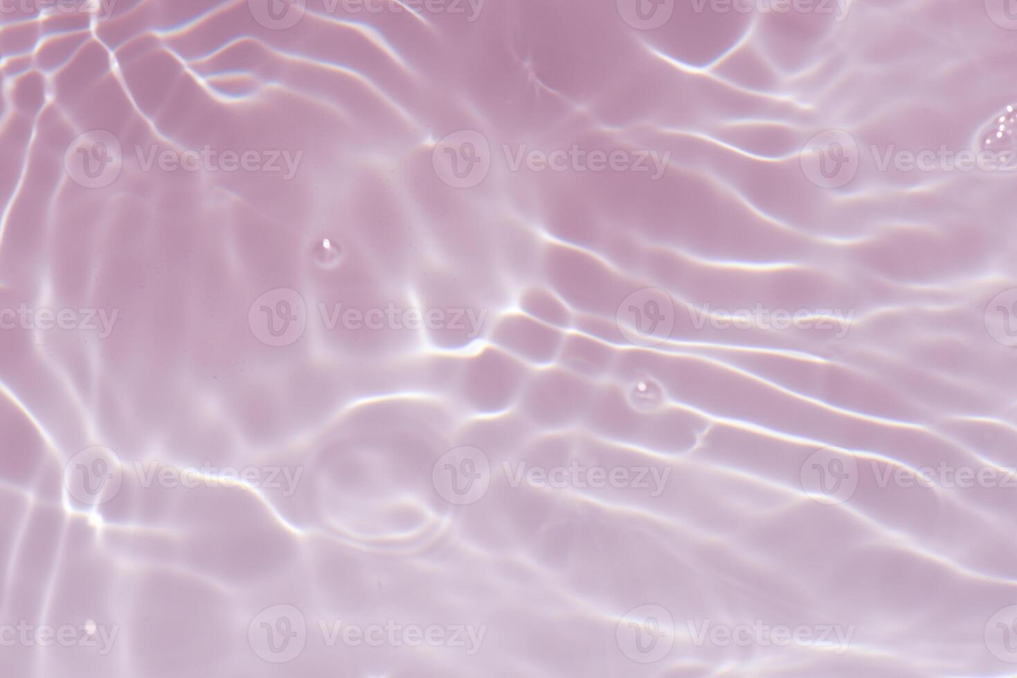 Bluewater waves on the surface ripples blurred. Defocus blurred transparent blue colored clear calm water surface texture with splash and bubbles. Water waves with shining pattern texture background. photo