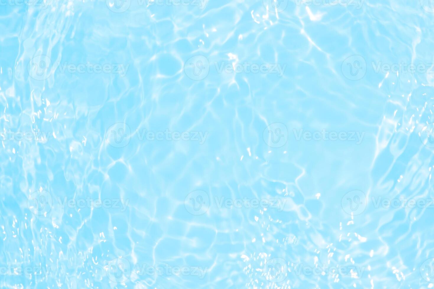Bluewater waves on the surface ripples blurred. Defocus blurred transparent blue colored clear calm water surface texture with splash and bubbles. Water waves with shining pattern texture background. photo