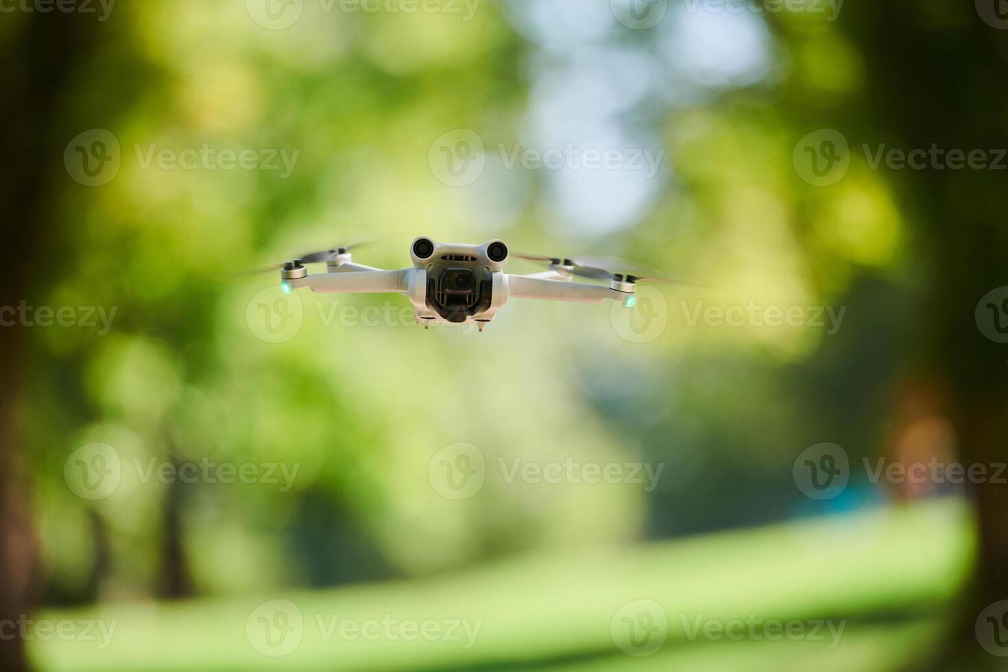 Professional drone filming the park on a sunny day photo