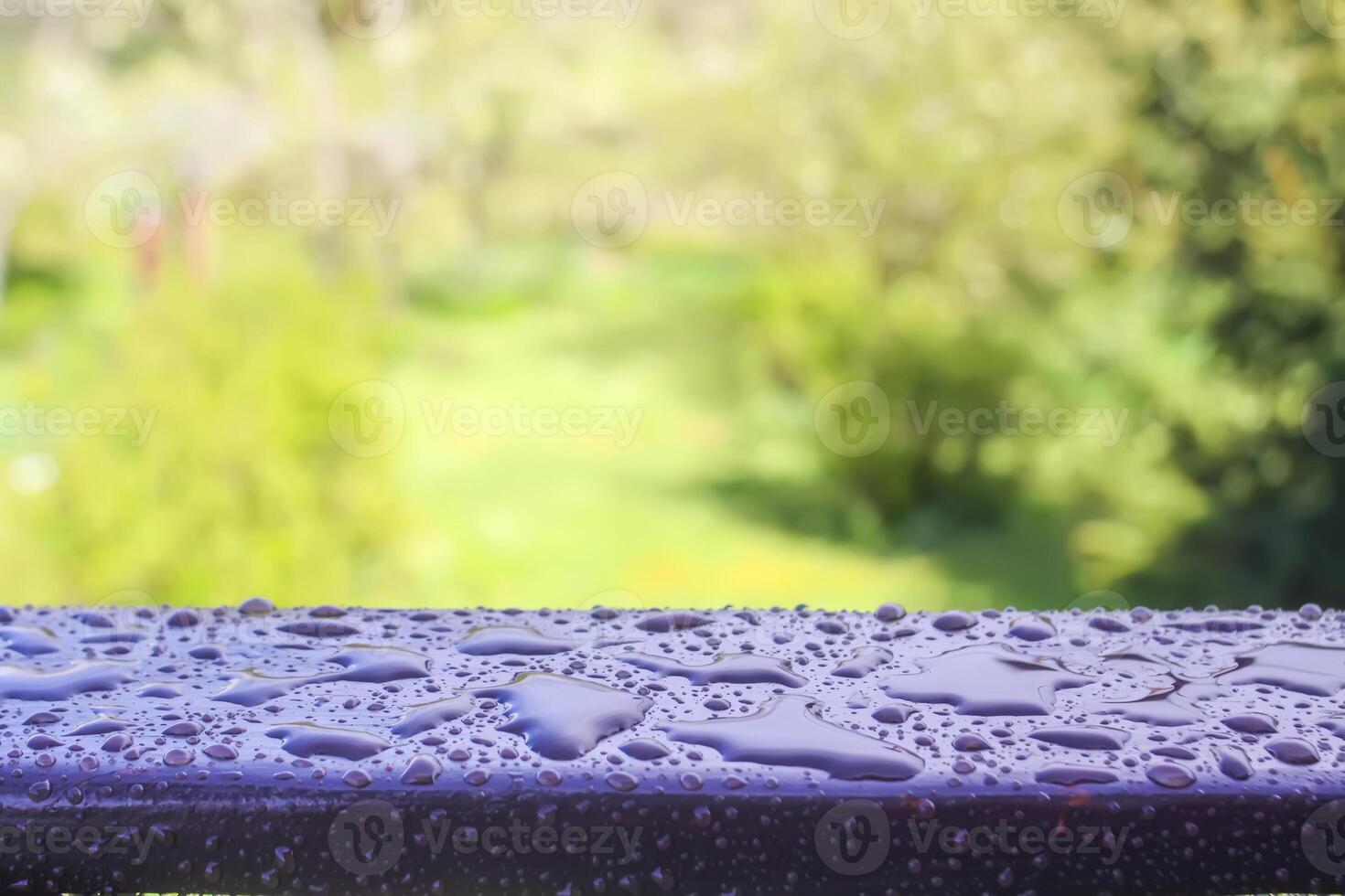 Wet wooden railing of terrace. Architecture detail in water drops after the rain. photo