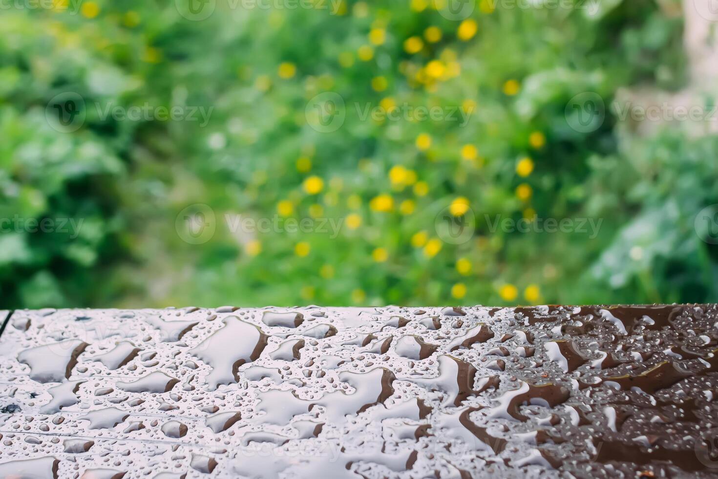 Wet wooden railing of terrace. Architecture detail in water drops after the rain. photo