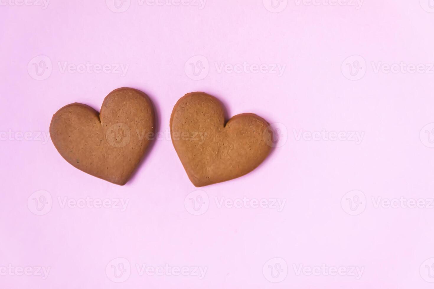 Gingerbread heart on colorful background. Valentine's day symbol. photo
