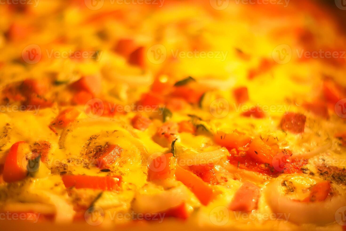 Pizza with tomatoes and meat baking in the oven photo