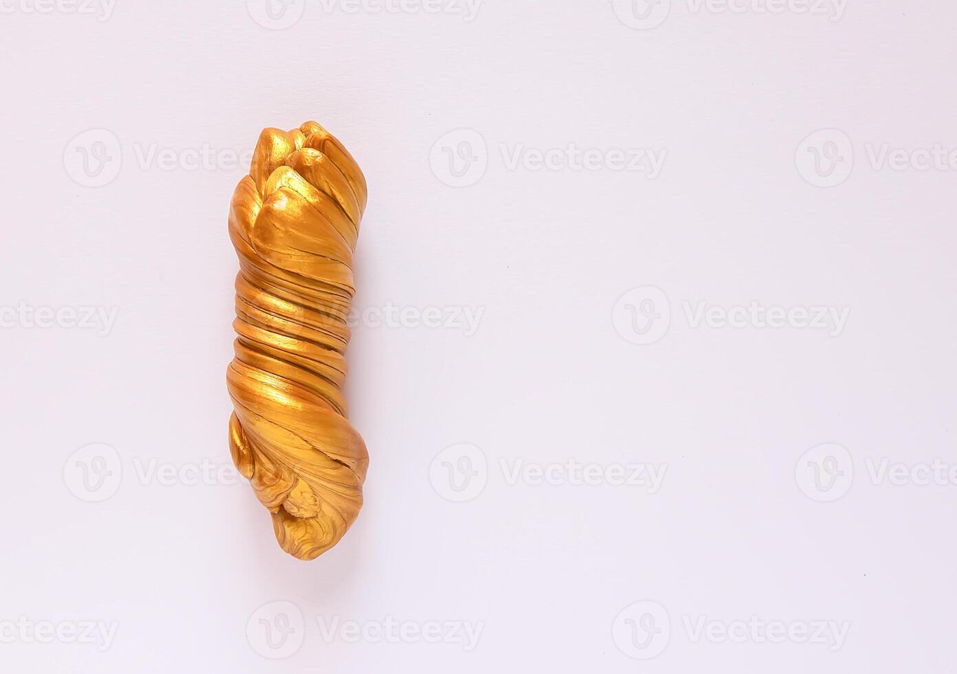 The pasticine texture. Golden mass for kids activity, toys, handmade, anti-stress. photo