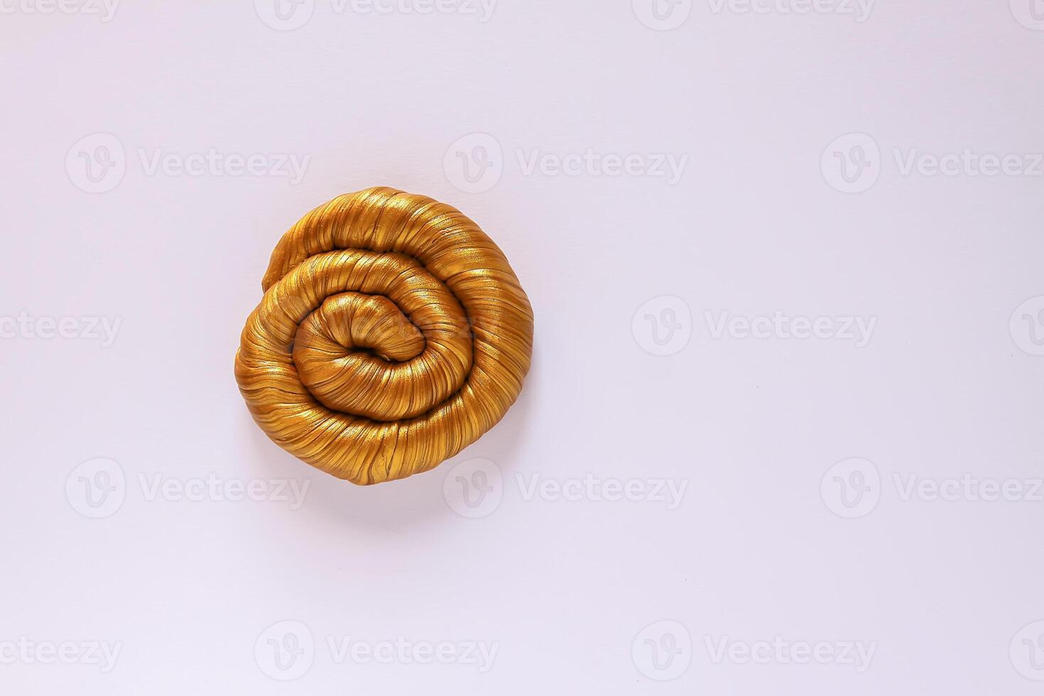 The pasticine texture. Golden mass for kids activity, toys, handmade, anti-stress. photo
