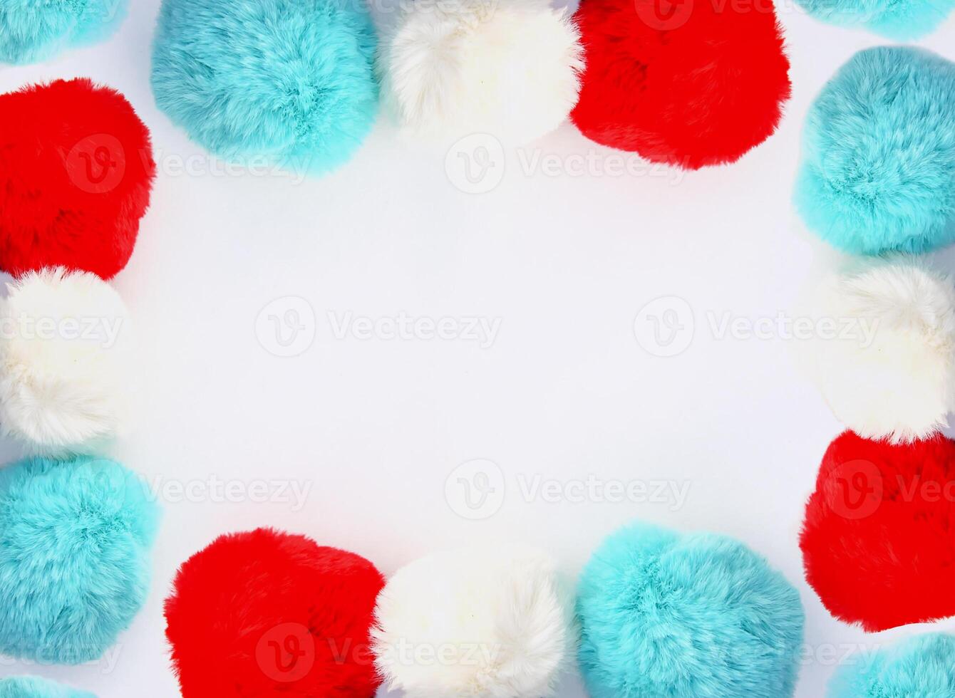 Colorful fluffy pompons on white background. Fashion decoration festive template. Design element for poster, banner, web, greeting card. photo