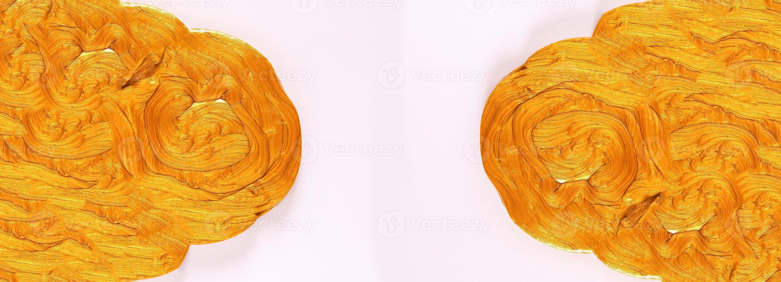 Golden plasticine soft stretchable texture. Anti-stress toy for kids activities, handmade, fun. photo