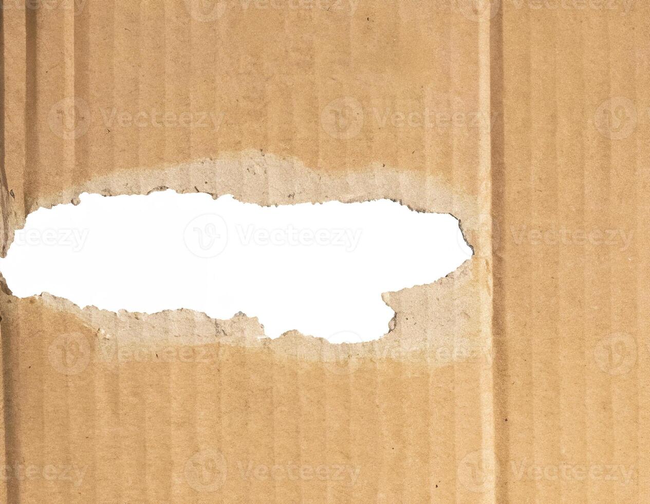 Torn Hole in Cardboard Paper photo