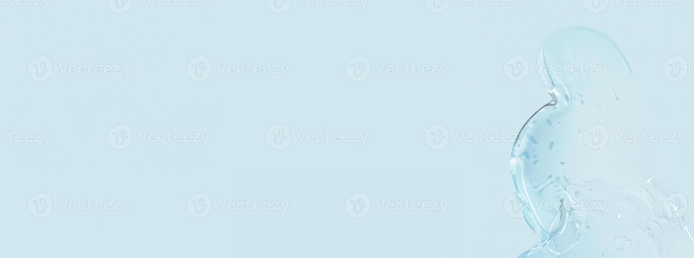 Transparent Gel Drops and Smears on Blue Background with Ad Space photo