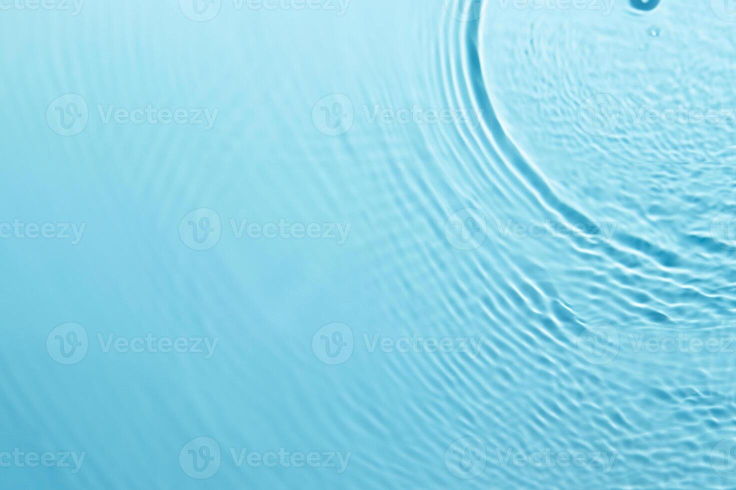 Blurred Blue Water Ripple with Bubbles and Sunlight Reflection - Calm and Clear Background photo