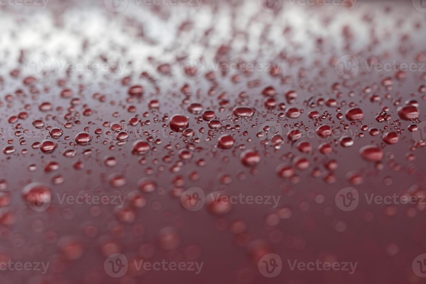 Hydrophobic Coated Red Sports Car with Rain Droplets photo