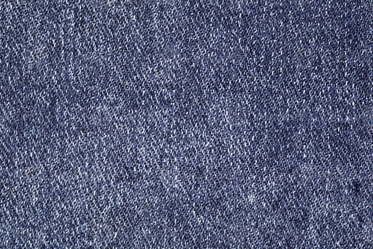 Close-Up of Dark Blue Denim with Visible Stitches and Uniform Texture photo
