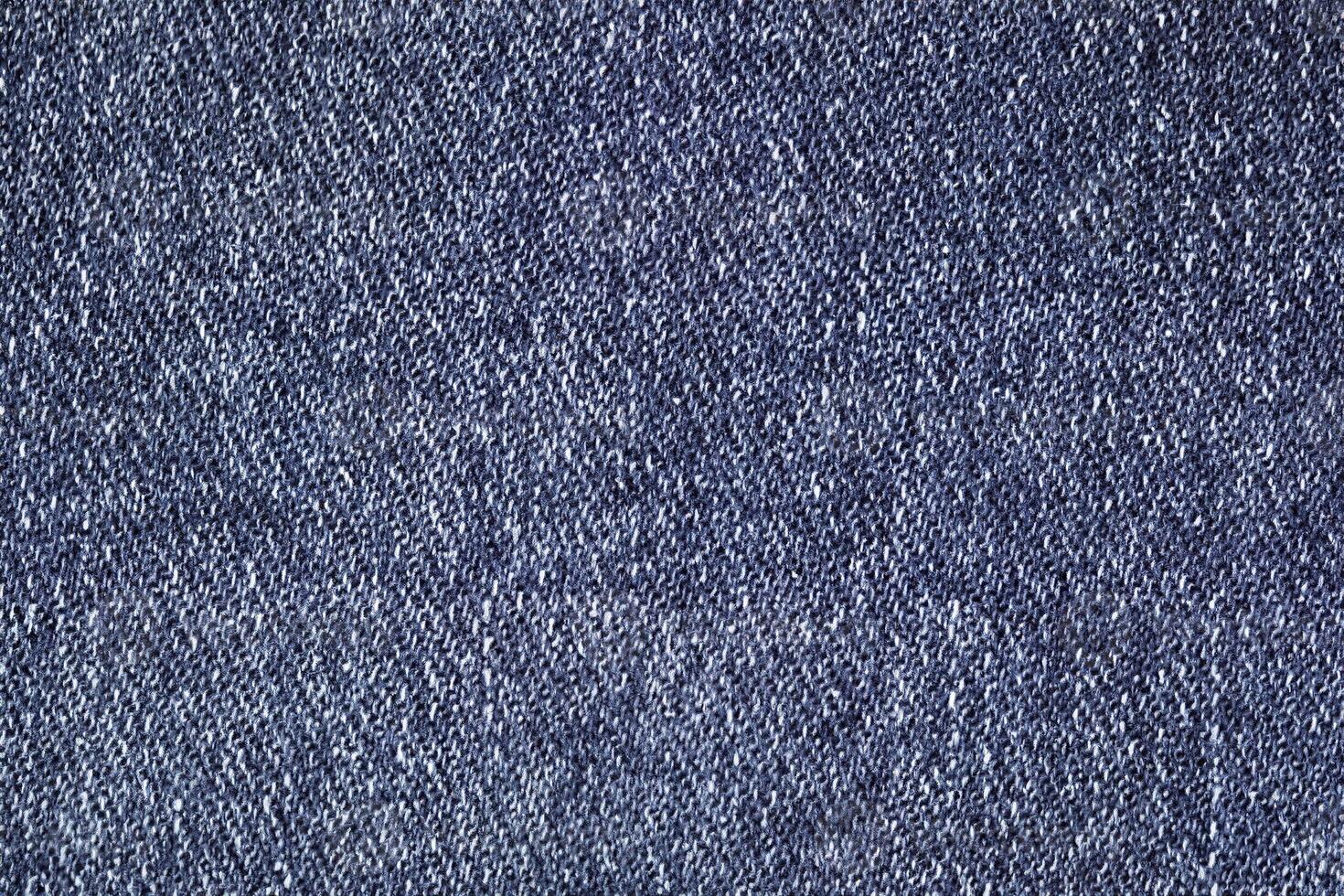 Close-Up of Dark Blue Denim with Visible Stitches and Uniform Texture photo