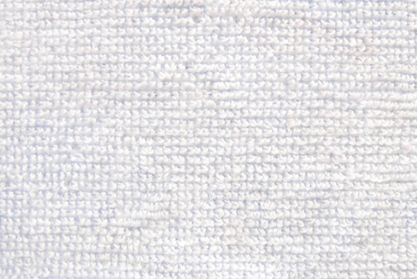 Close-Up of Soft White Towel Fabric Texture Background photo