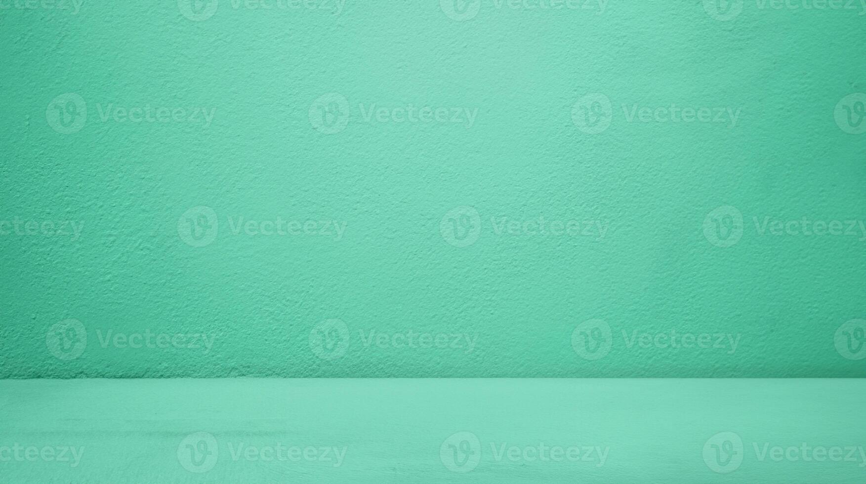 Minimalist Green Studio with Concrete Table and Gradient Background - Perfect for Product Display or Cosmetic Presentation photo