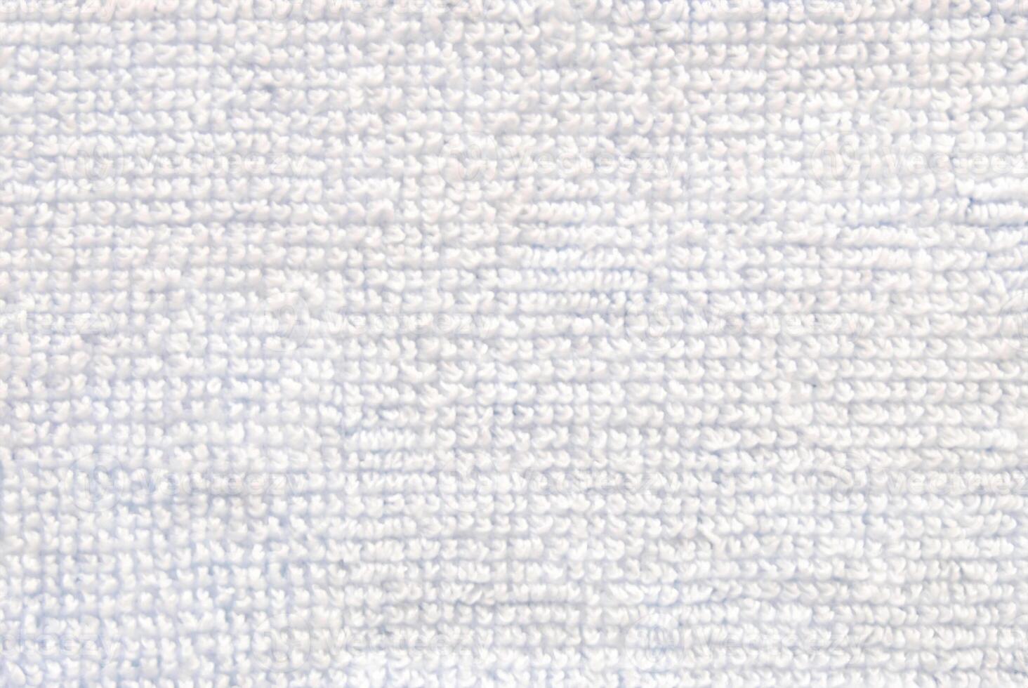 Close-Up of Soft White Towel Fabric Texture Background photo