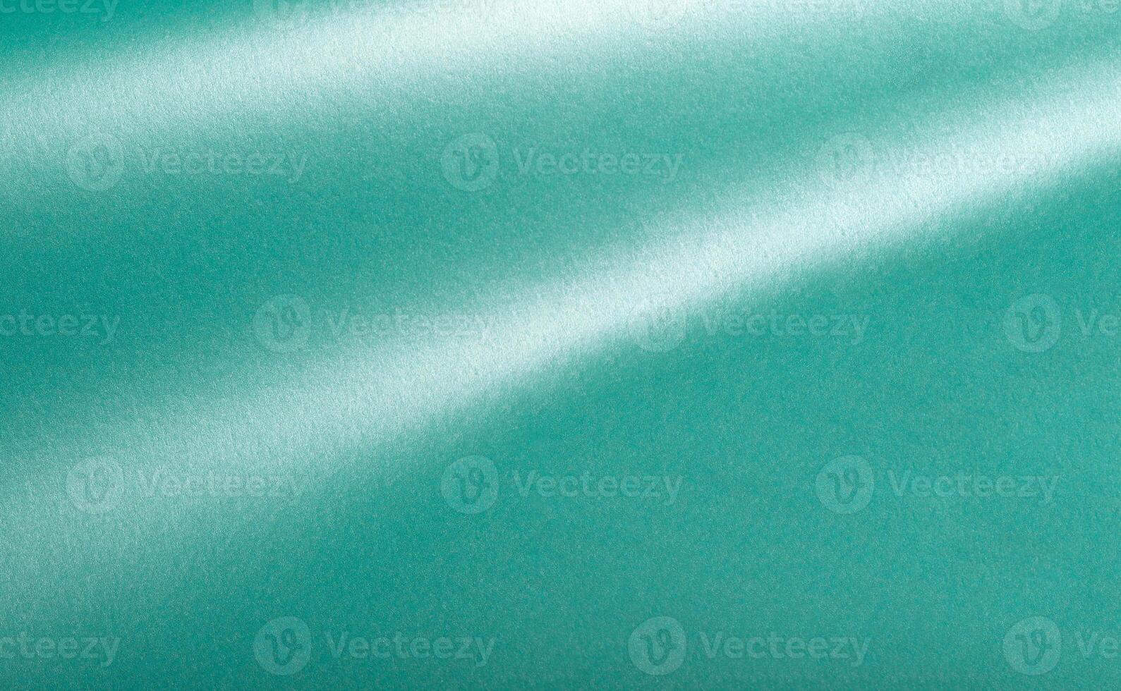 Turquoise color paper background, smooth glowing shining texture, wavy photo