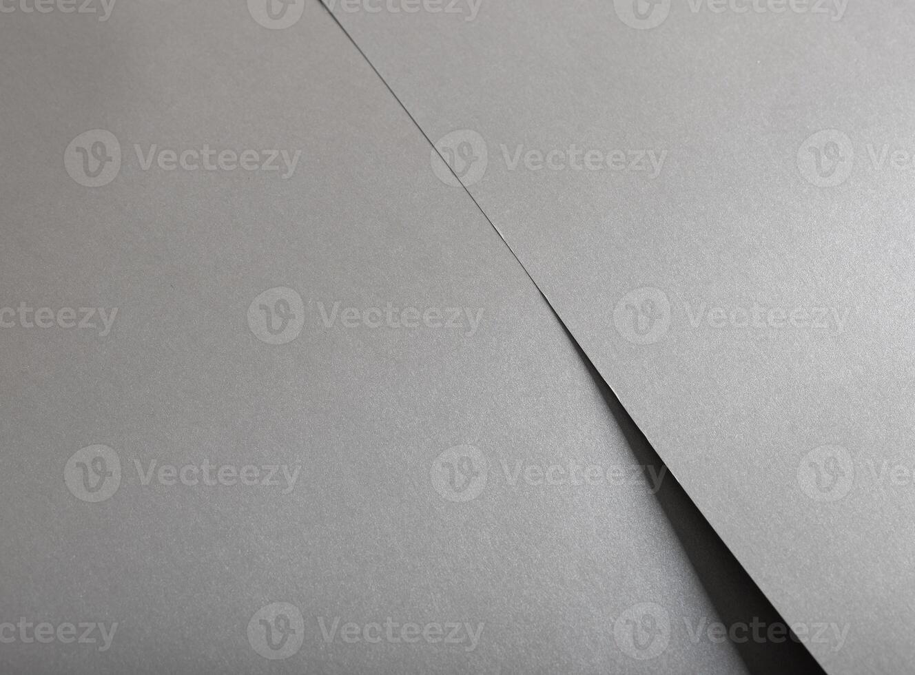 Gray shiny color paper background, smooth glowing shining silver aluminum texture photo