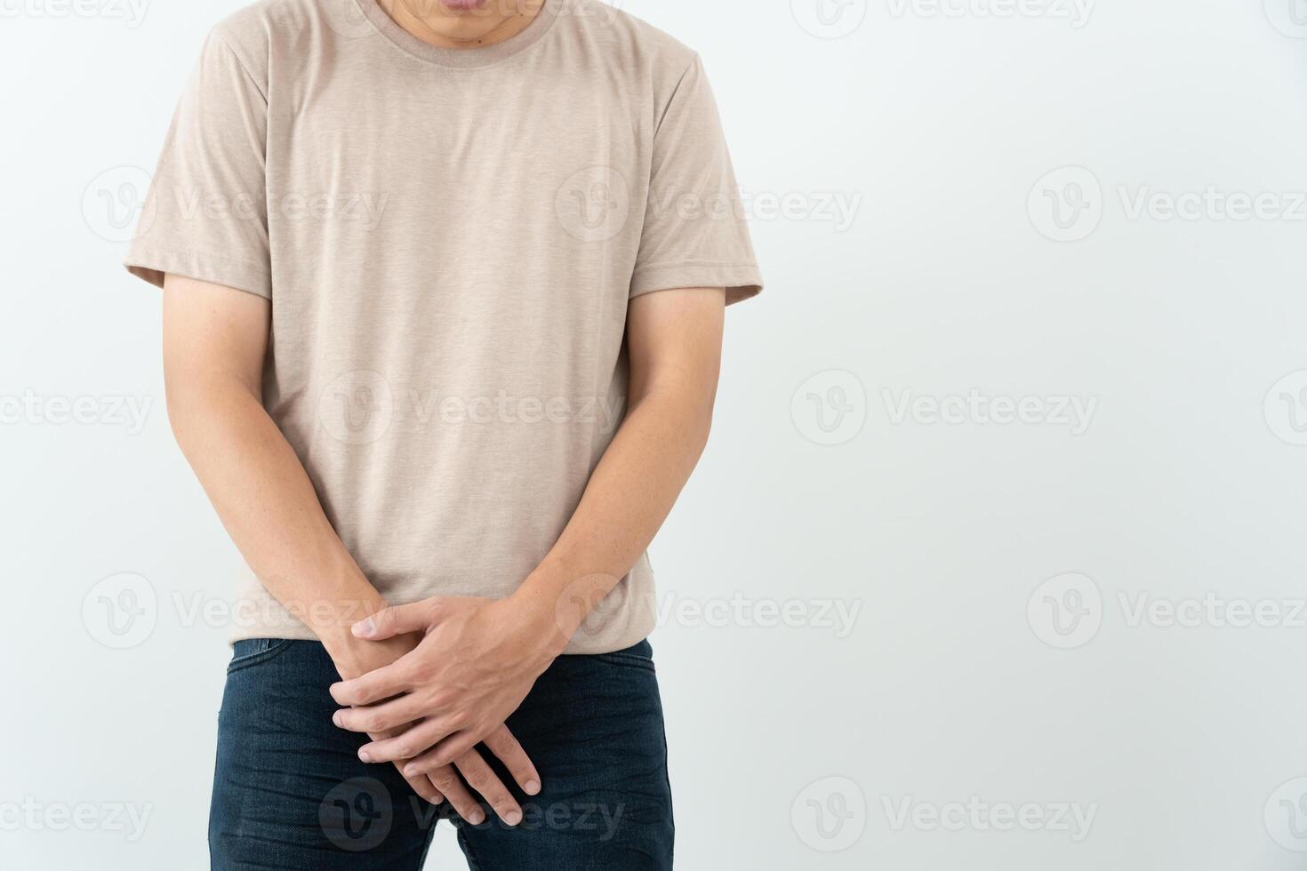Man hold hand in front of private parts feeling discomfort from disease and inflammation. Venereal, testicular cancer. bladder problems, erectile dysfunction, premature ejaculation, prostate cancer photo