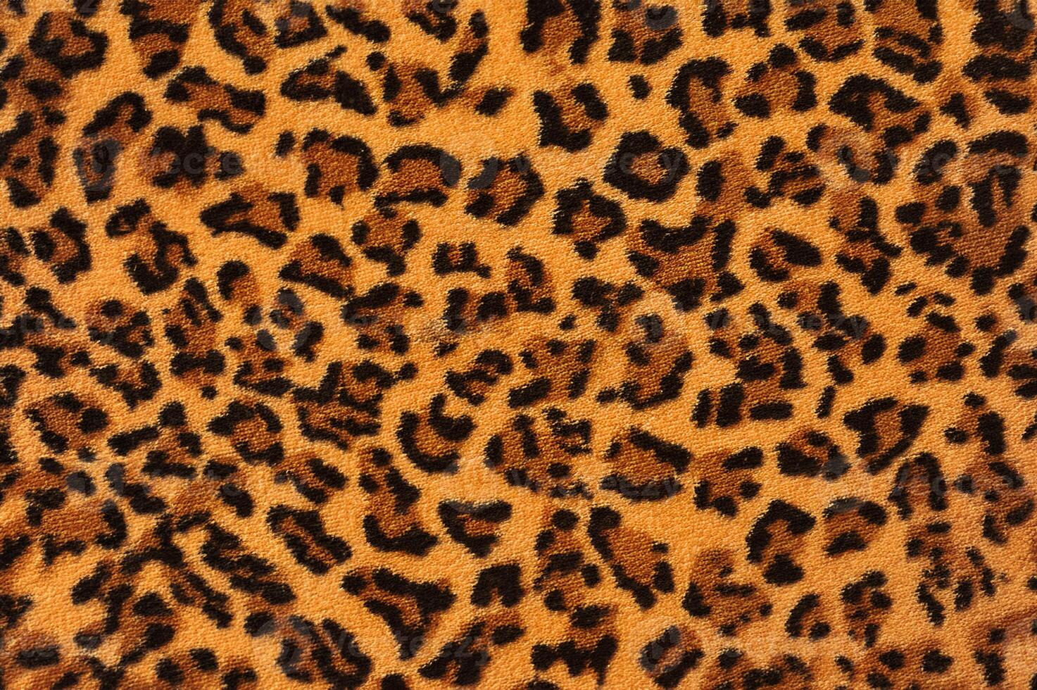 Close-Up of Leopard Print Fabric Texture photo