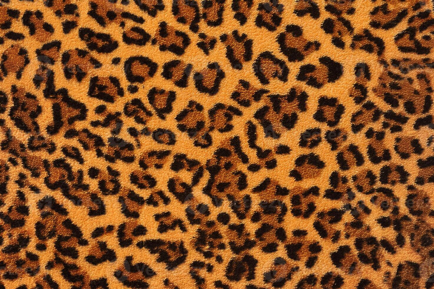 Close-Up of Leopard Print Fabric Texture photo