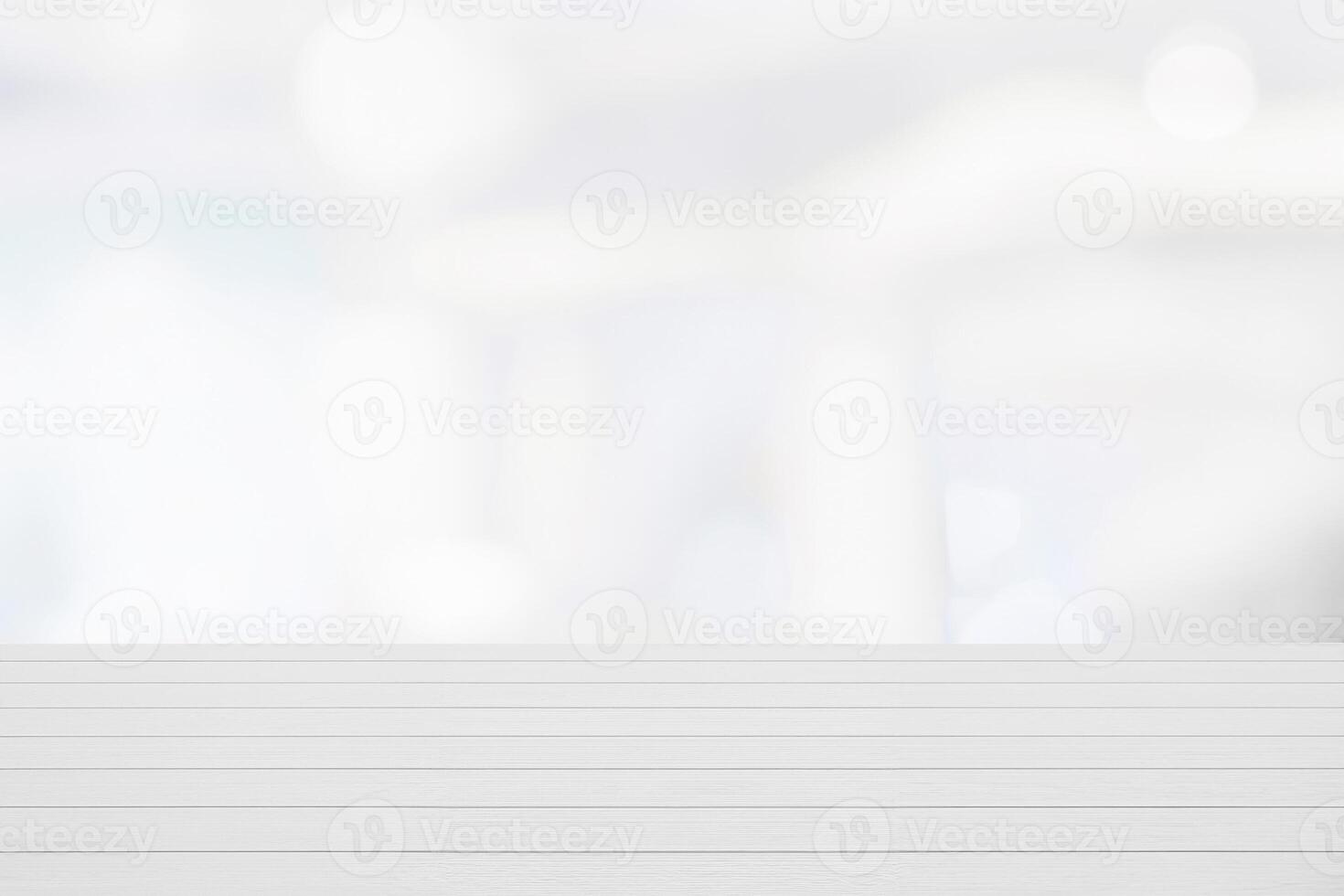 Wooden Table in Modern Office with Blurry Window and White Wall - Empty Surface for Product Display or Mockup photo