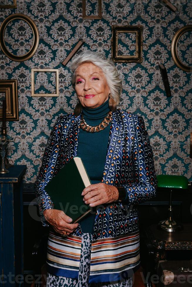 Elegant elderly woman in luxury wear radiating confidence and wealth while standing at retro style house photo