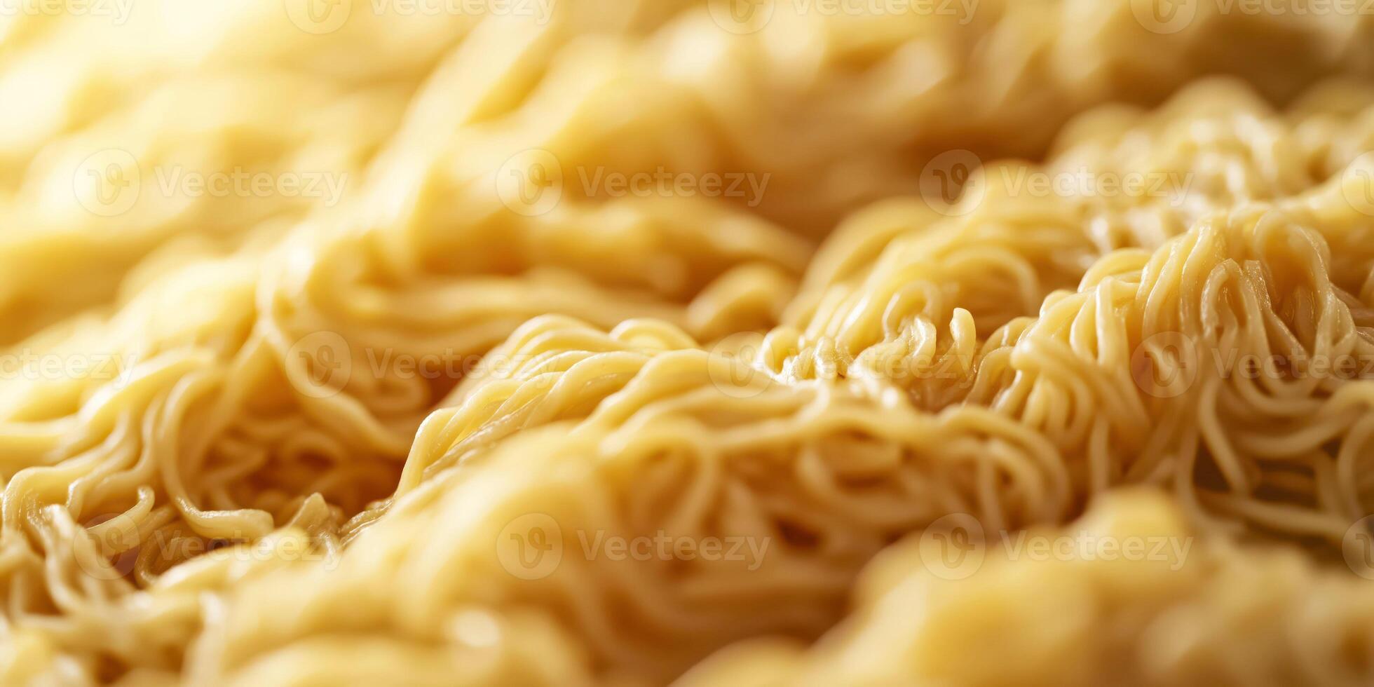 Close-up of cooked instant noodles with soft lighting and textured patterns photo