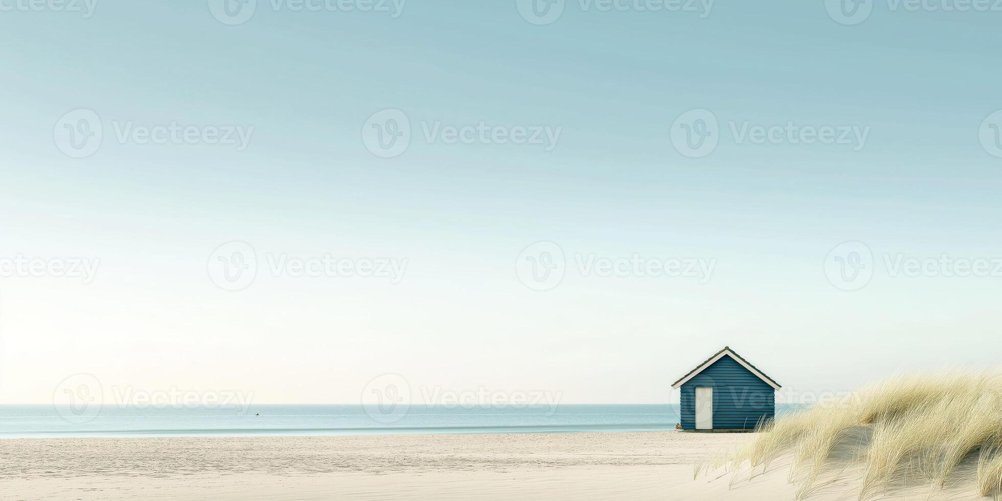 Tranquil beach landscape with blue hut and grassy dunes at sunrise photo
