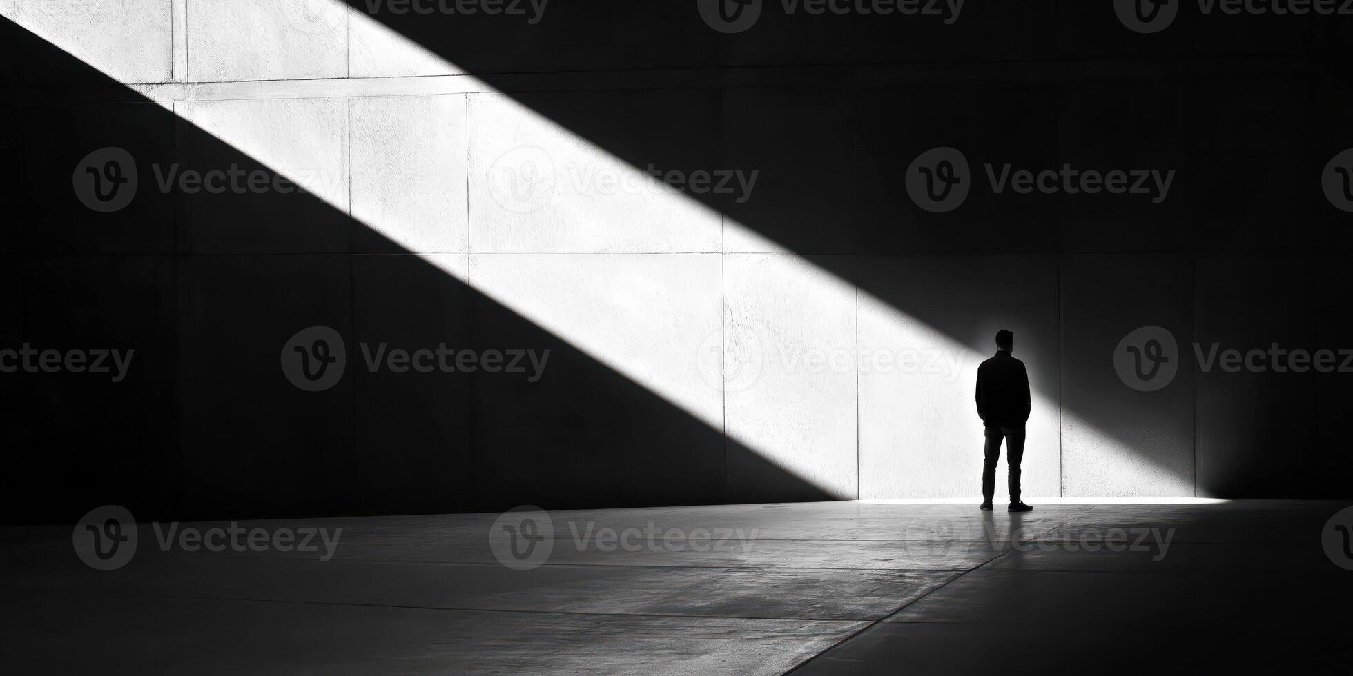 Solitude in geometry silhouette in dramatic light and shadow photo