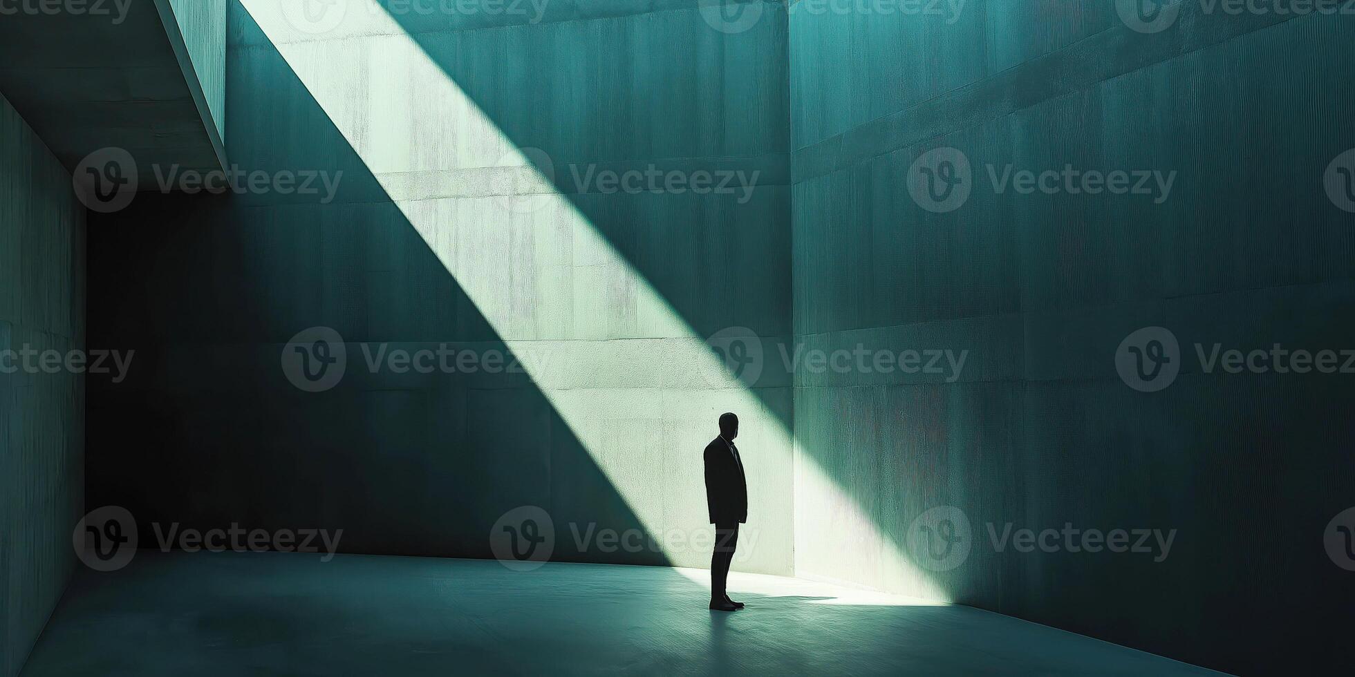 Solitary figure in dramatic light exploring architectural space photo