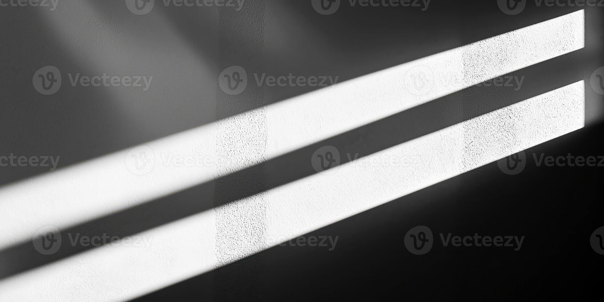 Abstract light patterns on a textured wall creating dynamic contrast and shadow play photo