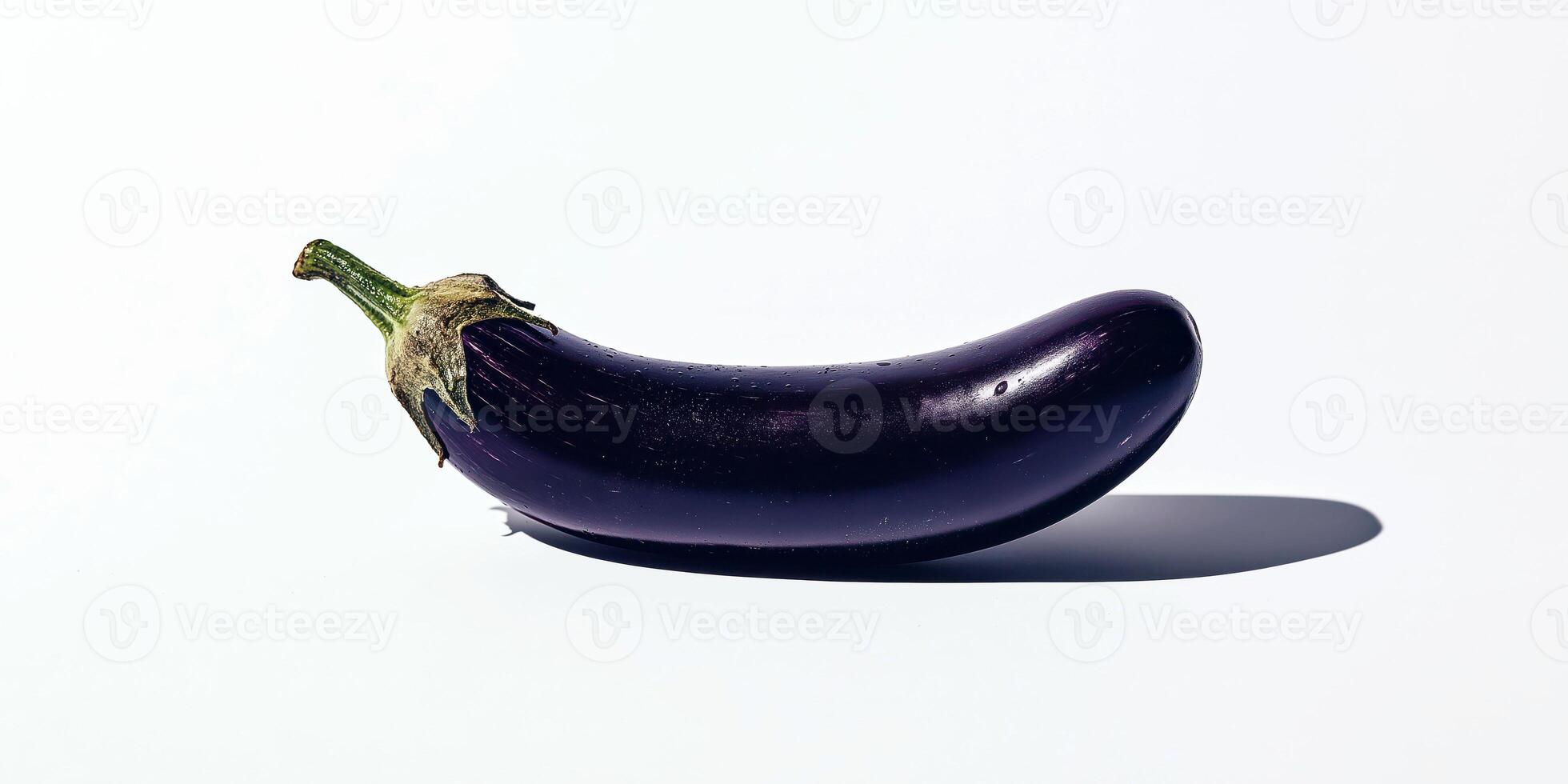 Minimalist eggplant isolated on light background with shadow in natural lighting photo