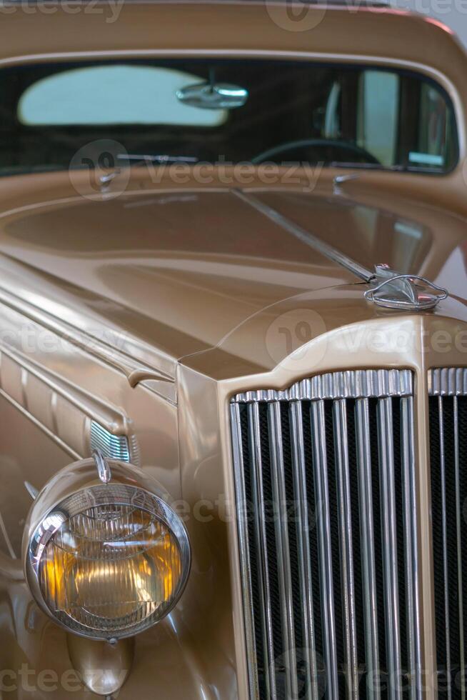 Vintage, shiny car against the background of the night sky. photo
