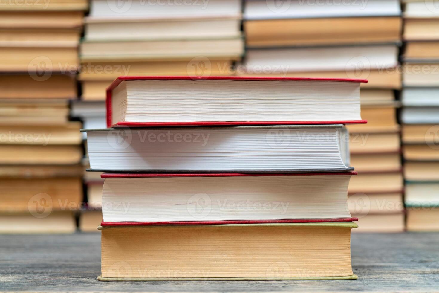 Stack of books in the library. Symbol of knowledge and learning. photo
