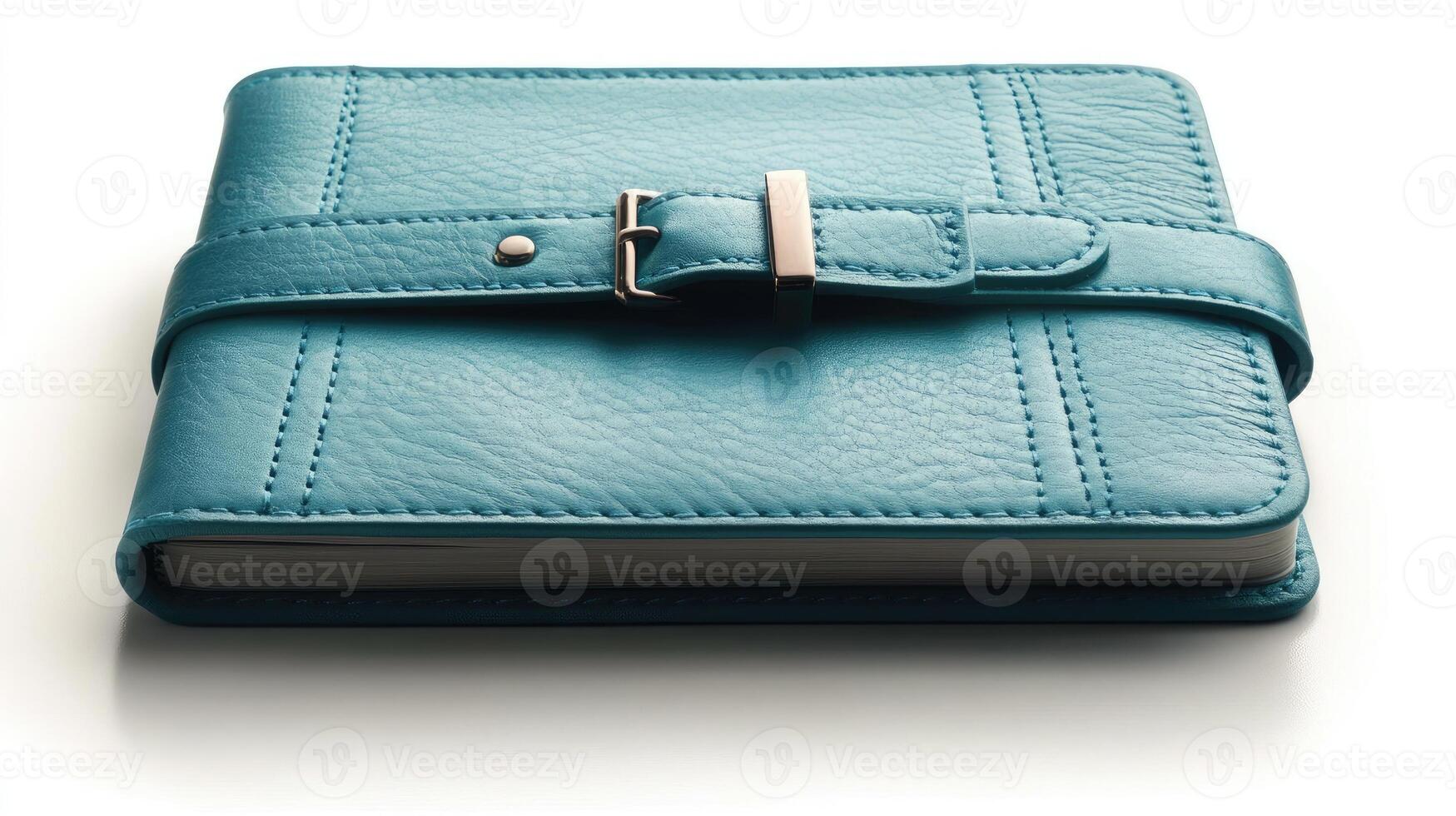 Green leather notebook with a silver buckle closure is laying photo