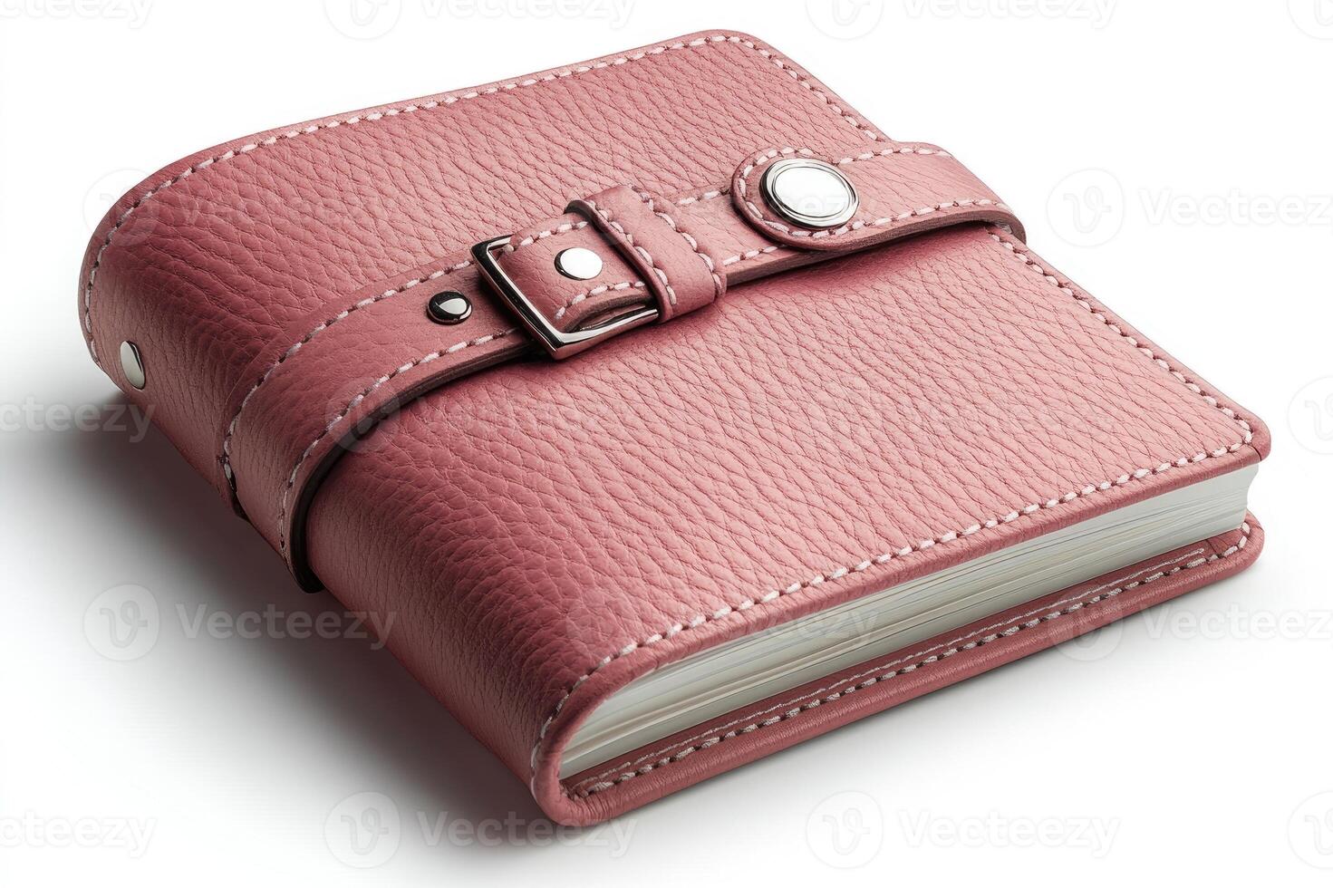 Pink leather notebook closed with a strap on white background photo