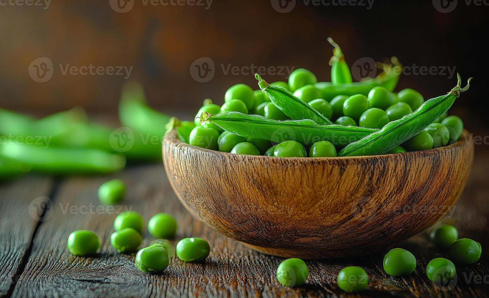 A bowl of green peas is sitting on a wooden table. Concept of freshness and health, as peas are a nutritious vegetable photo