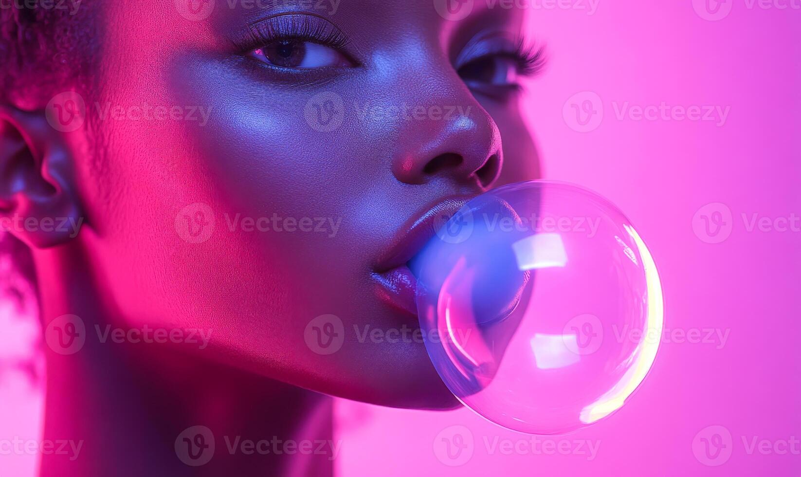 A woman is blowing bubbles with a pink bubblegum. The image has a playful and fun mood, as the woman is enjoying herself while blowing bubbles photo