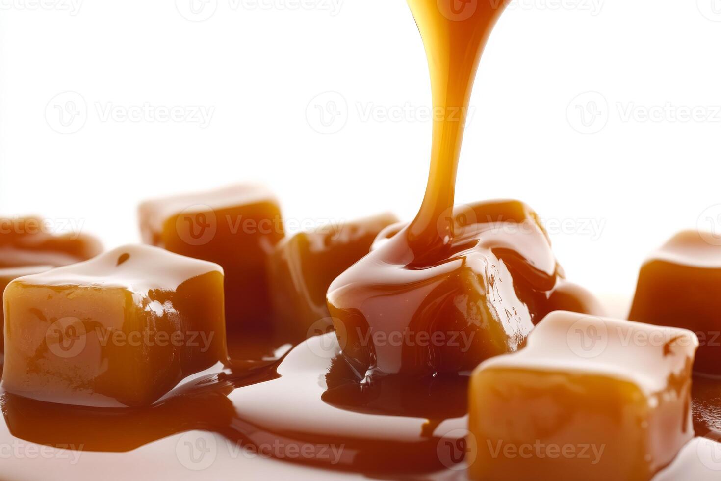 Indulge in the rich, creamy caramel sauce that is beautifully pooling over luscious, decadent caramel cubes photo