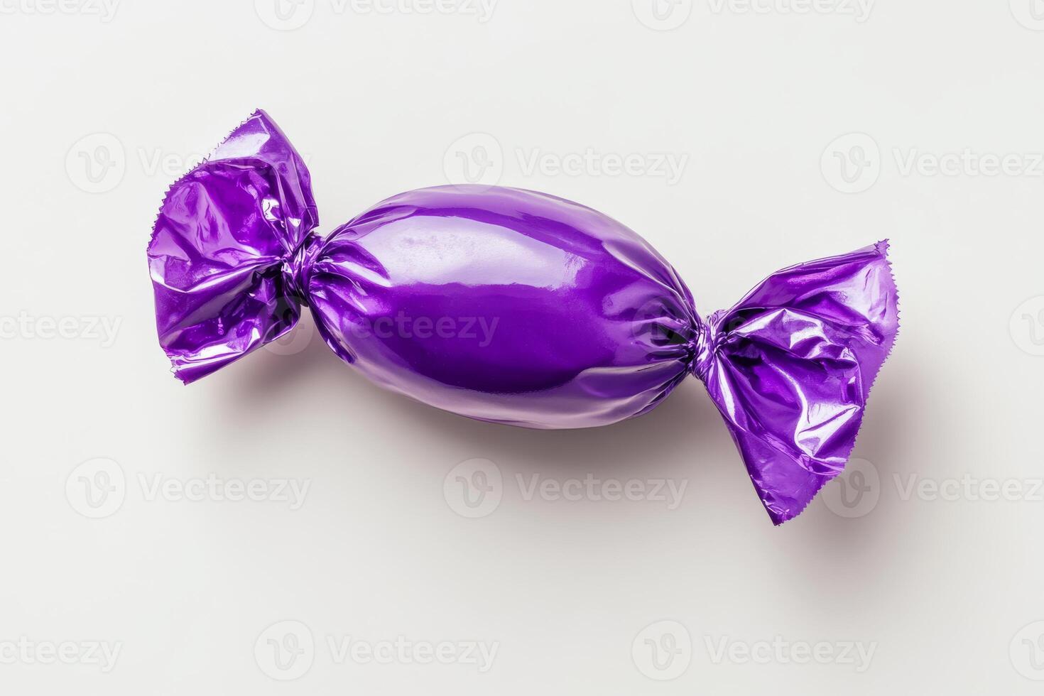 A shiny purple candy wrapped in elegant foil, perfect for sweet lovers. Its ideal for enhancing confectionery collections and making special occasions memorable, making it a great gift choice photo