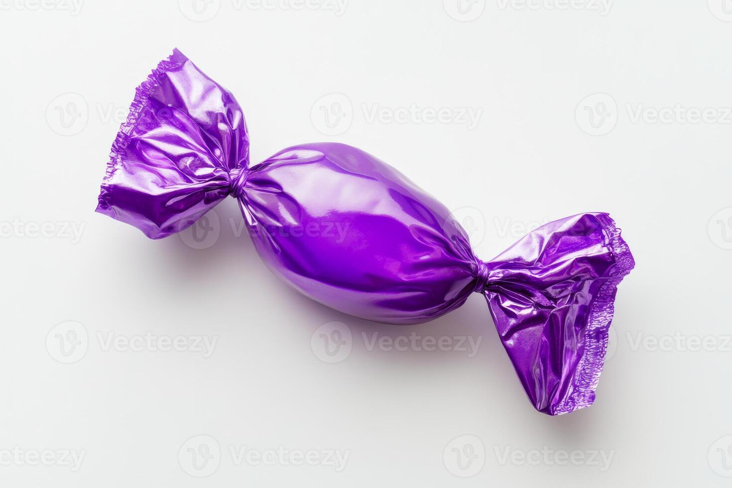 This shiny and vibrant purple candy, elegantly wrapped in foil, features a simple yet charming design that perfectly enhances sweet treats and creates attractive displays at any type of celebration photo
