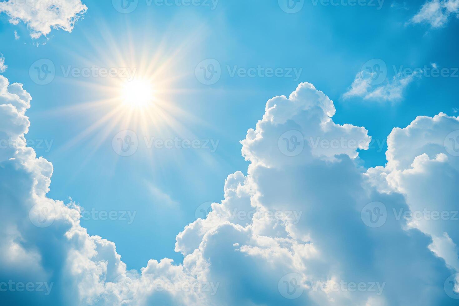 A breathtakingly beautiful sky is filled with fluffy, white clouds, all illuminated by radiant sunlight, which collectively creates a peaceful and uplifting atmosphere that soothes the soul photo